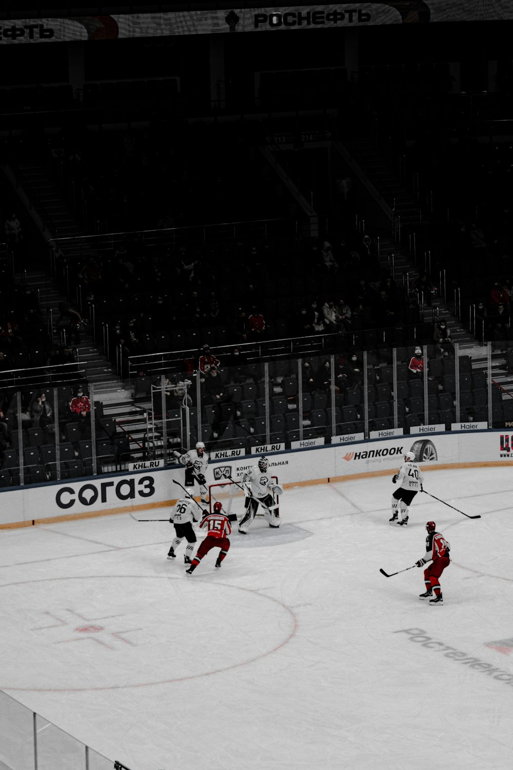 people playing ice hockey on ice stadium