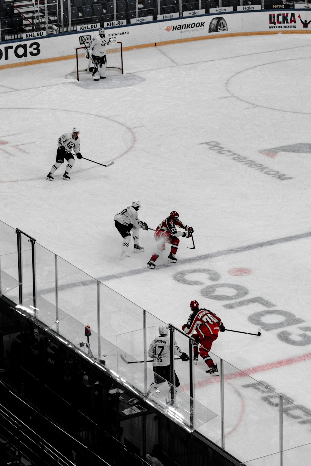 people playing ice hockey on ice field