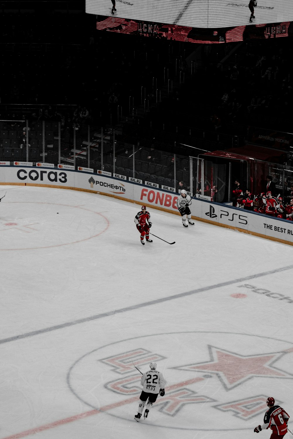 people playing ice hockey on ice field