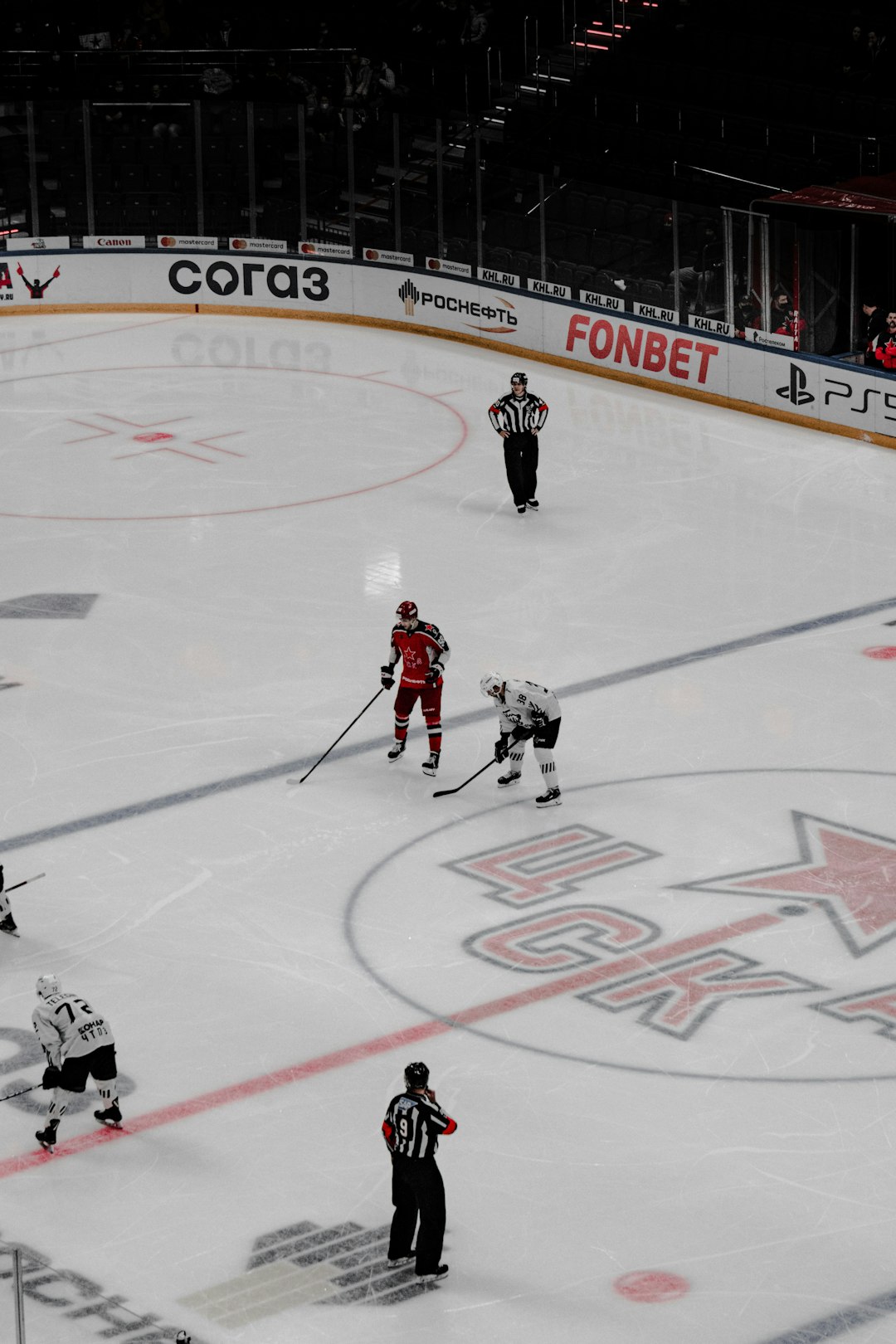 people playing ice hockey on ice hockey field