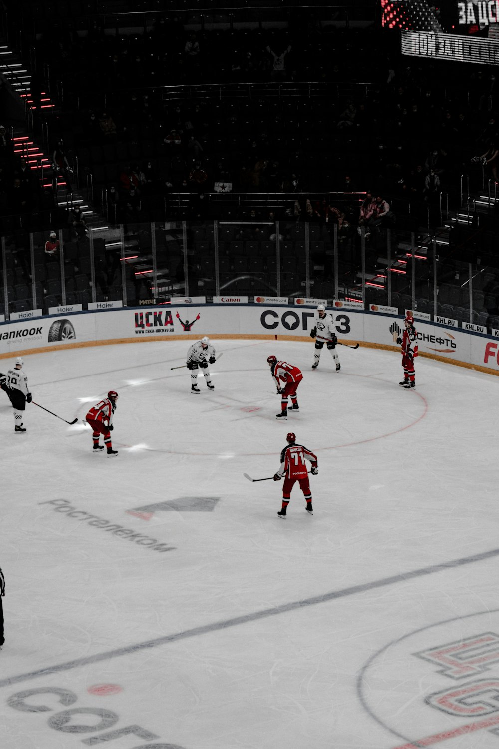 people playing ice hockey on ice field