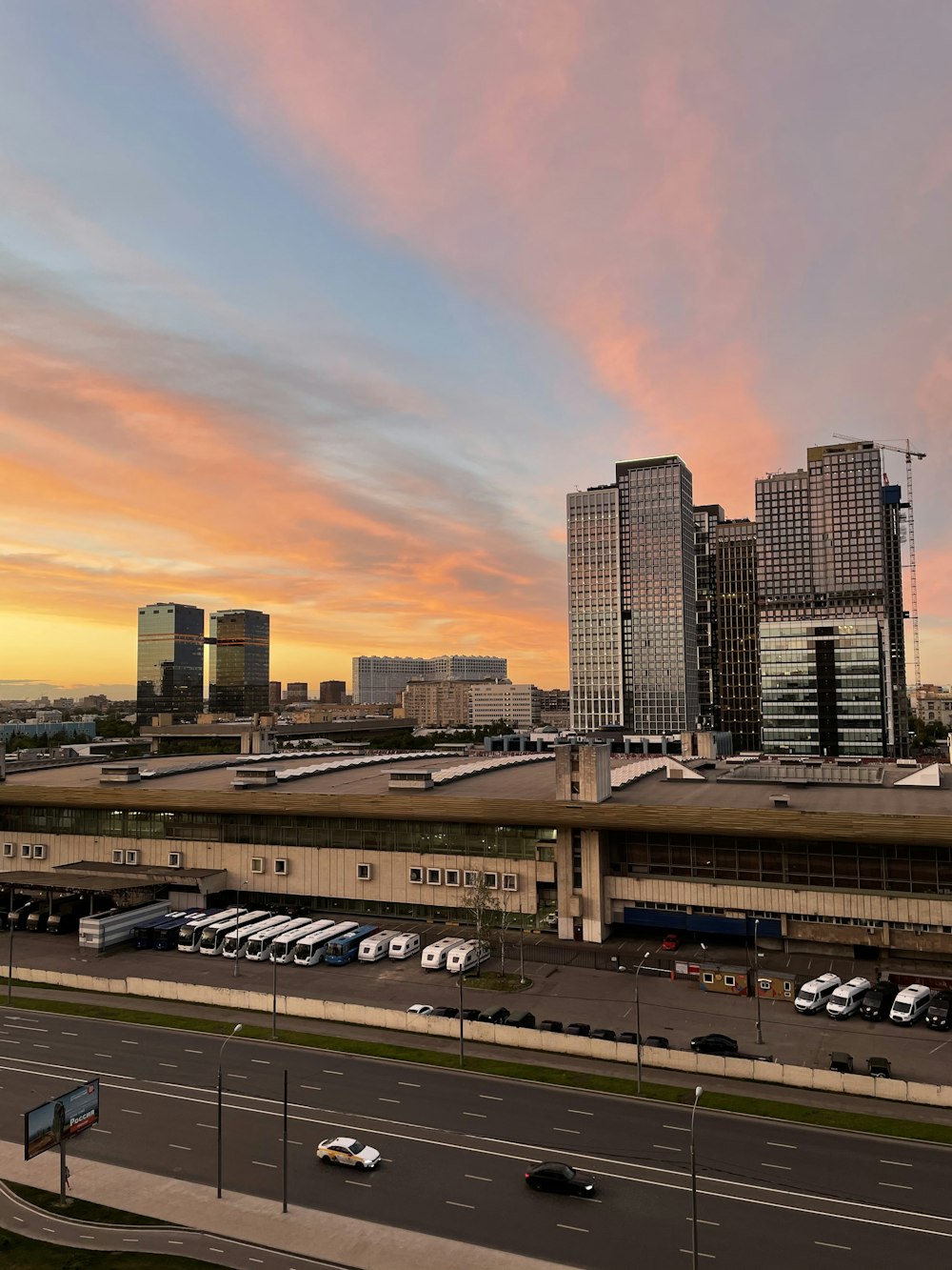 cars on road near buildings during daytime