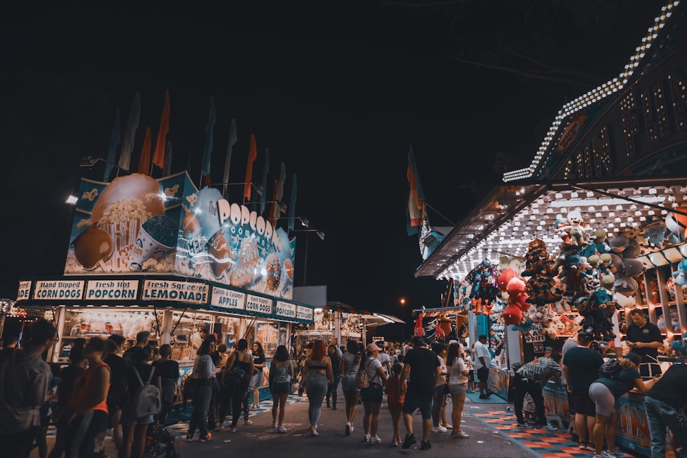 people gathering in a concert during night time