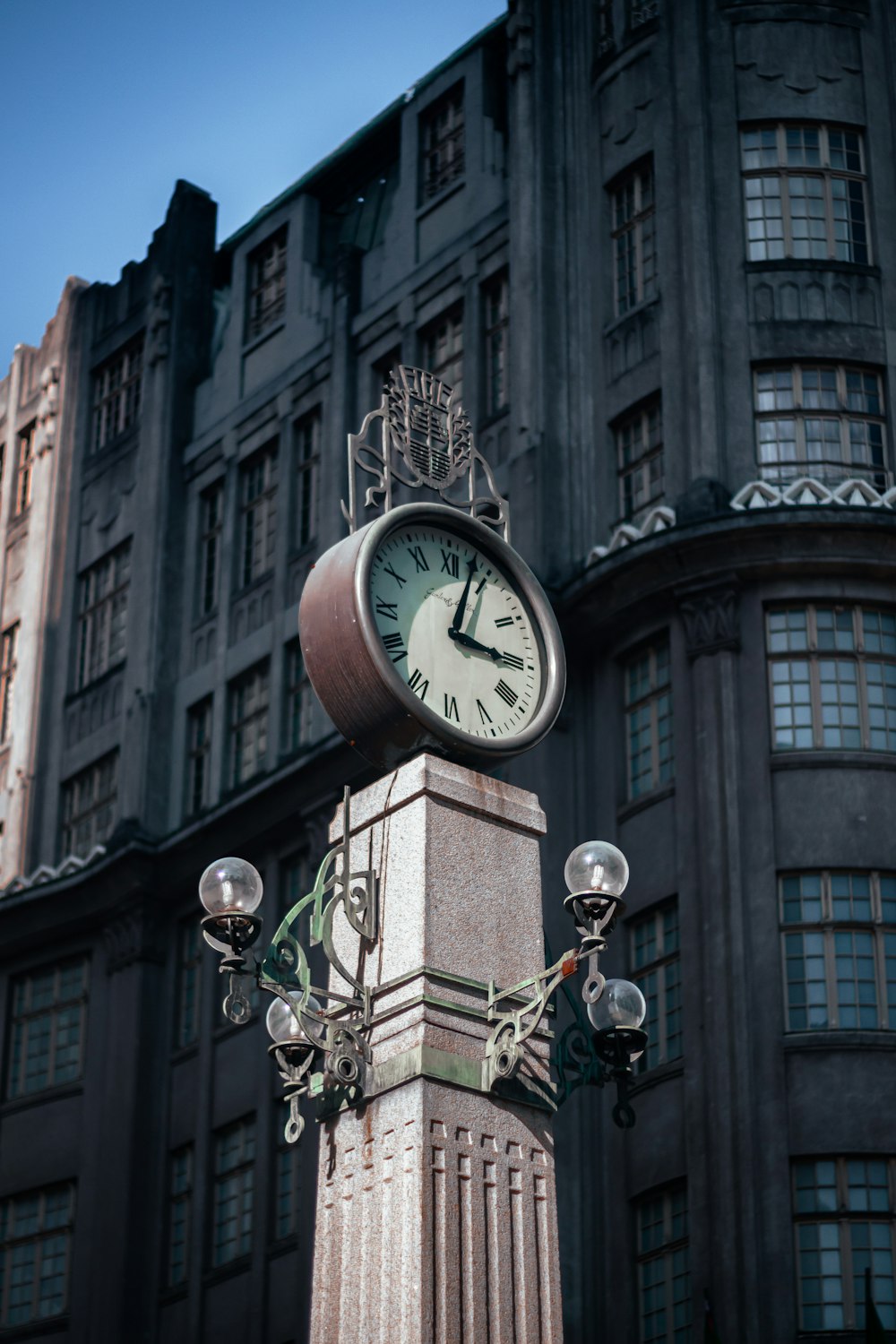 white and brown analog clock at 11 00