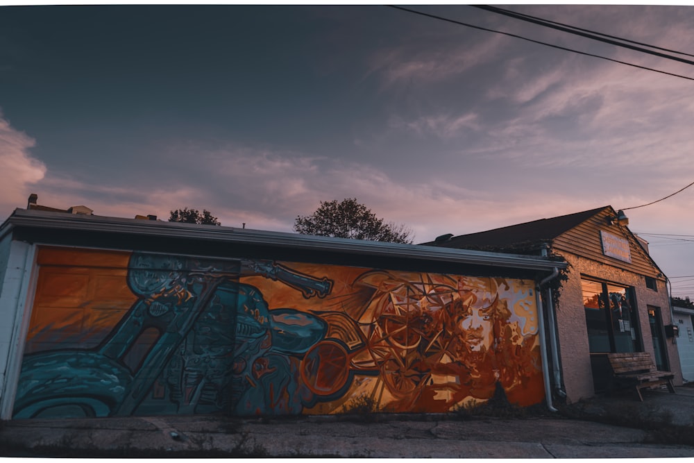 brown and black graffiti on wall