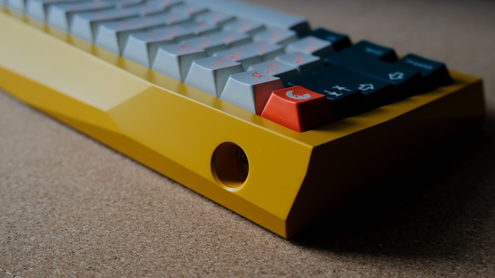 white and yellow computer keyboard