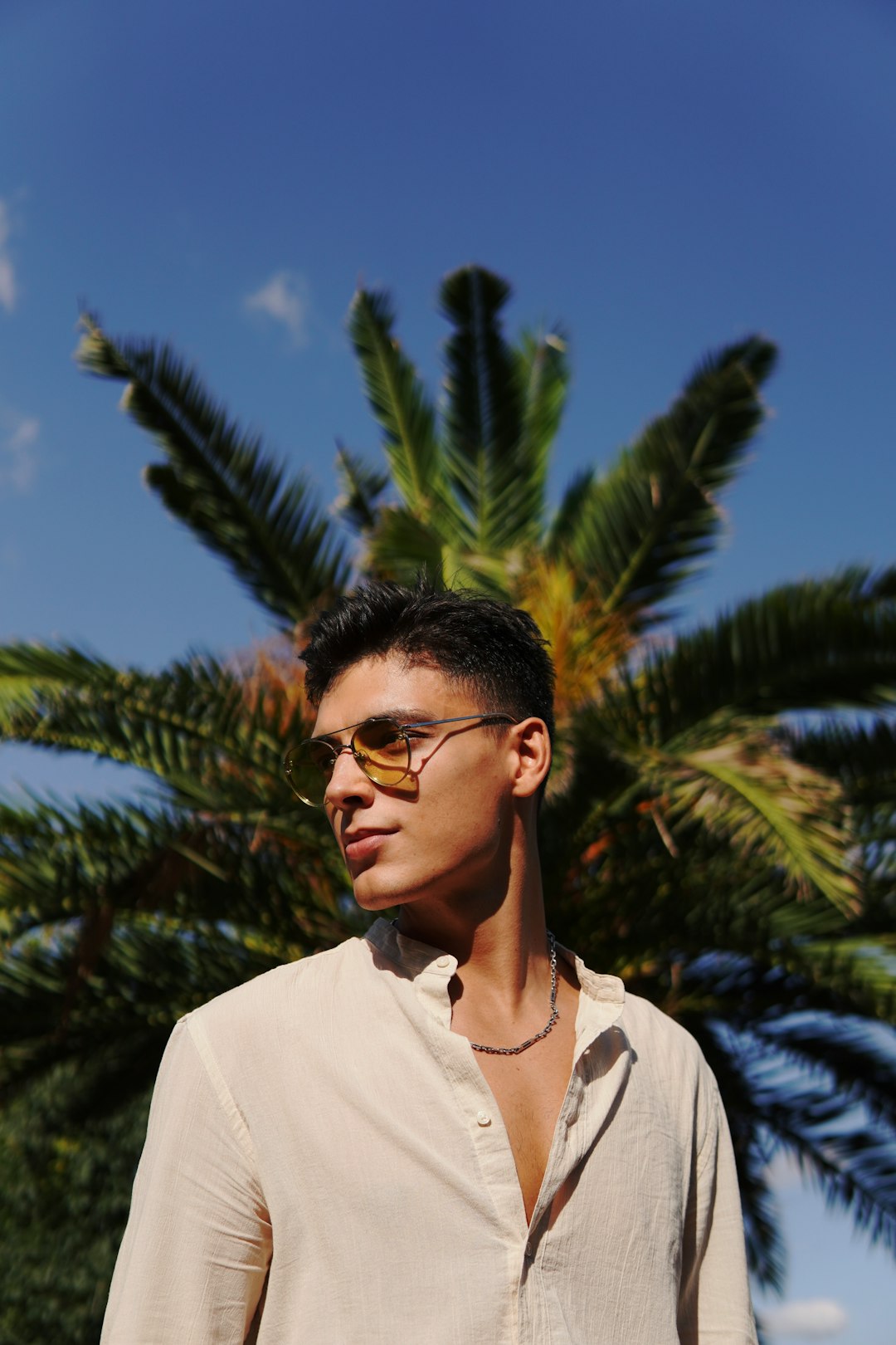 man in white button up shirt wearing black framed eyeglasses