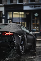 black porsche 911 parked on street during daytime