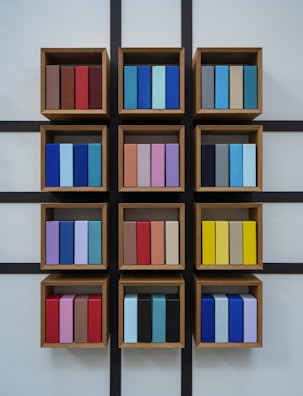 A colorful wall-mounted shelf crafted from reclaimed wood.