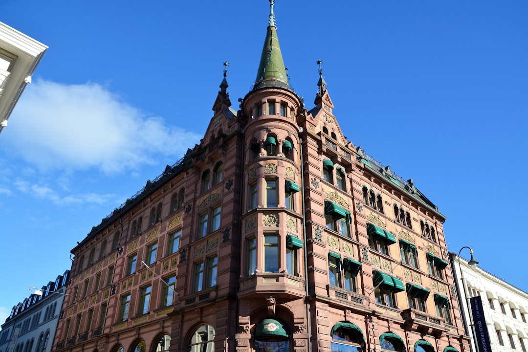 brown concrete building under blue sky during daytime