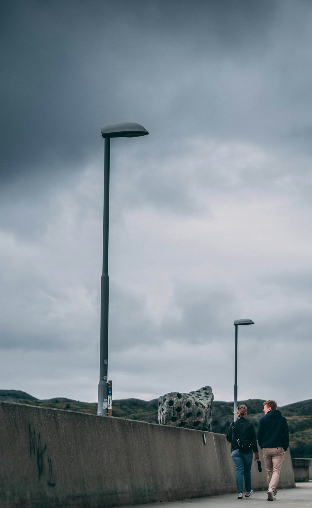 gray street lamp under gray cloudy sky