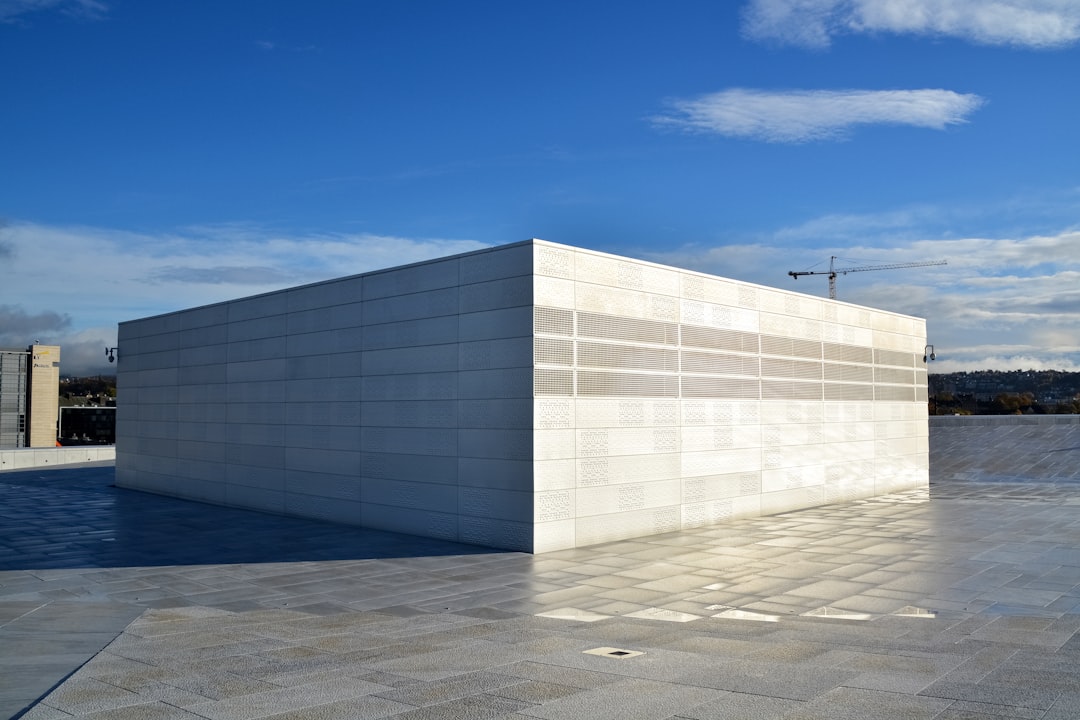 white concrete building under blue sky during daytime