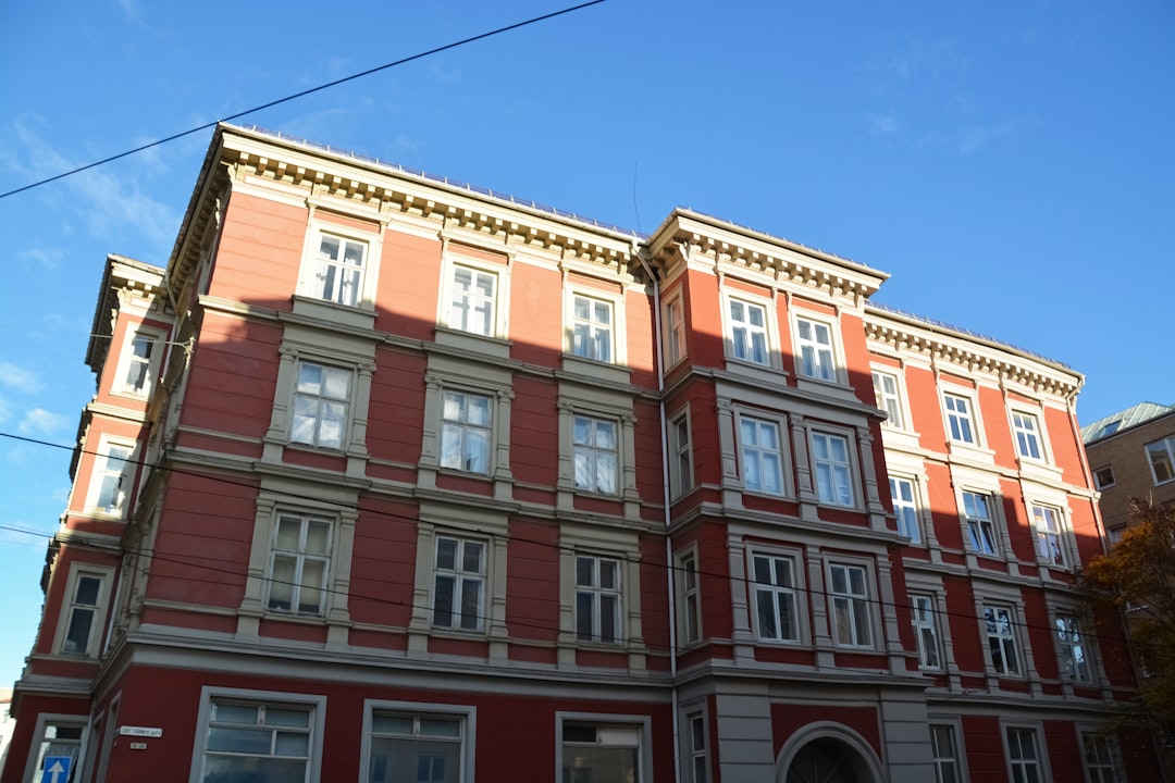 brown and white concrete building under blue sky during daytime