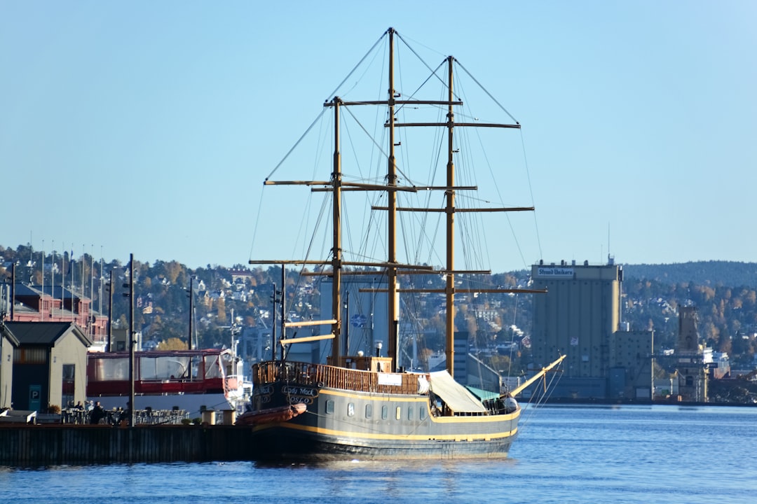 white and brown ship on dock during daytime