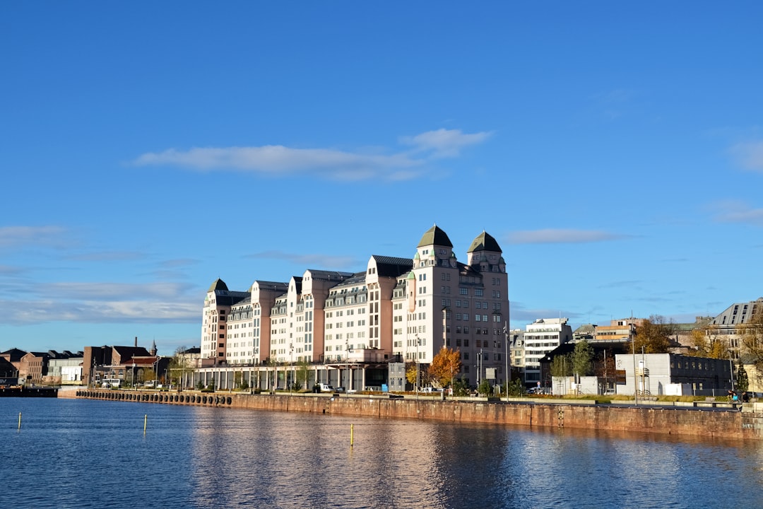 white concrete building near body of water during daytime