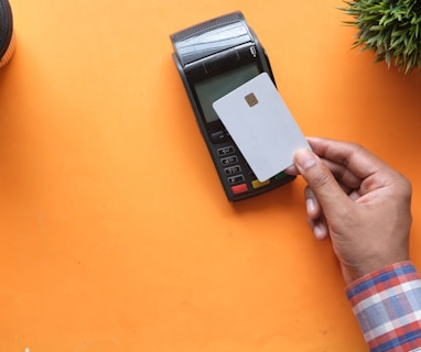 person holding black and white electronic device