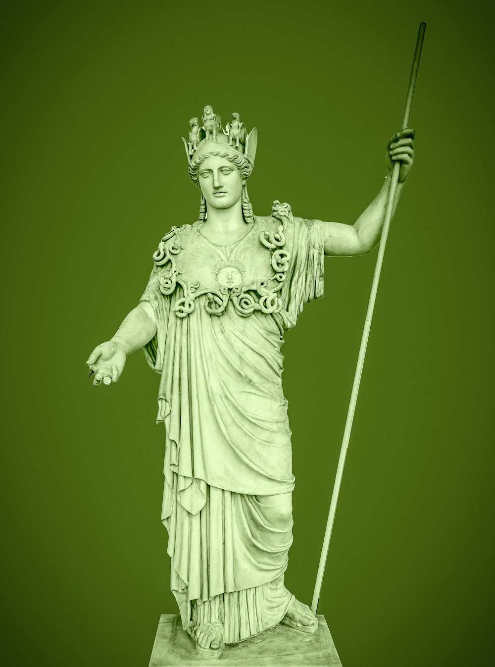 a statue of a woman holding a staff