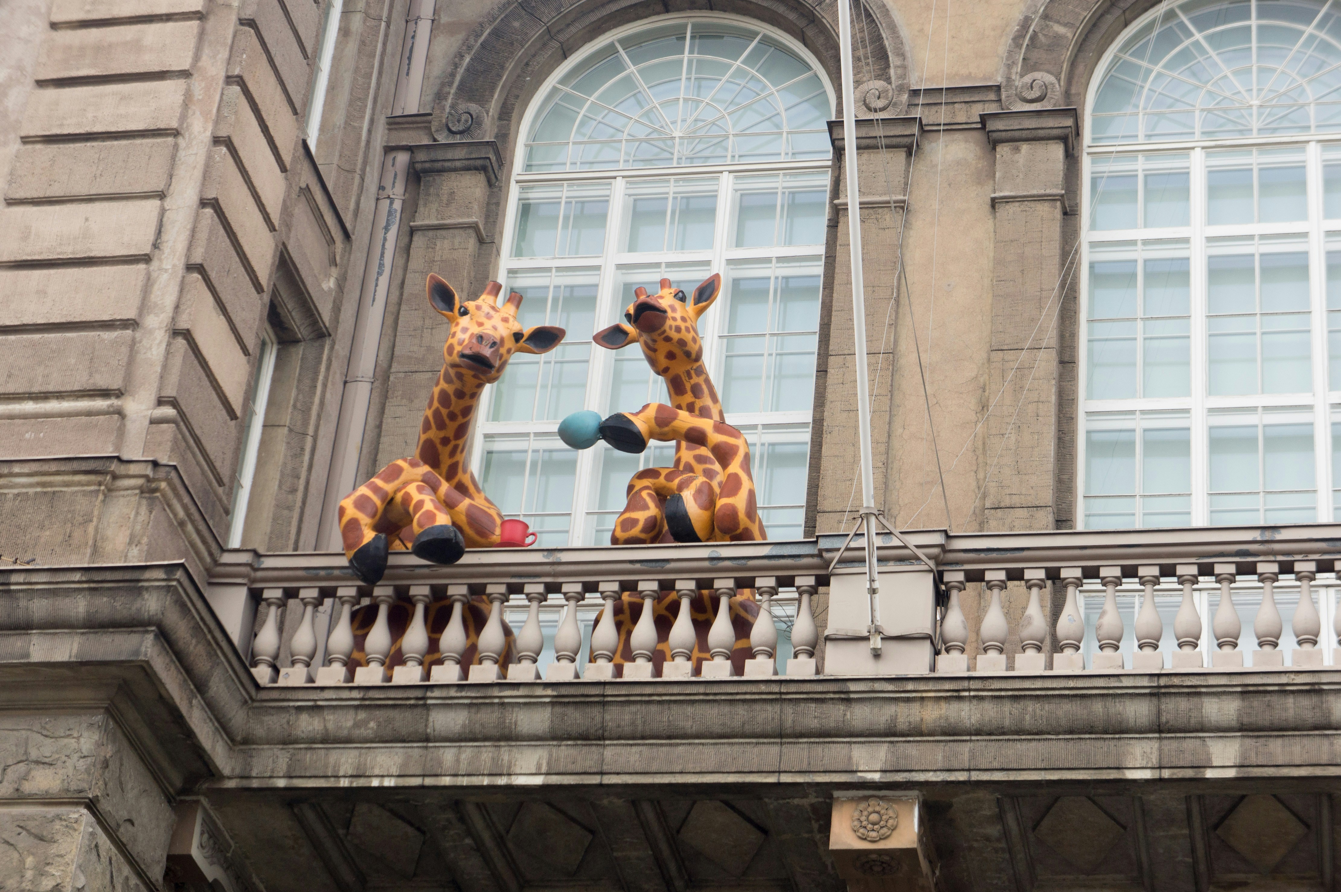 woman wearing yellow long-sleeved dress under white clouds and blue sky during daytime