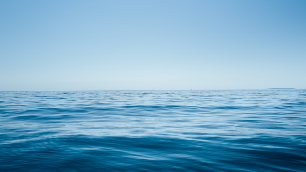 blue sea under blue sky during daytime