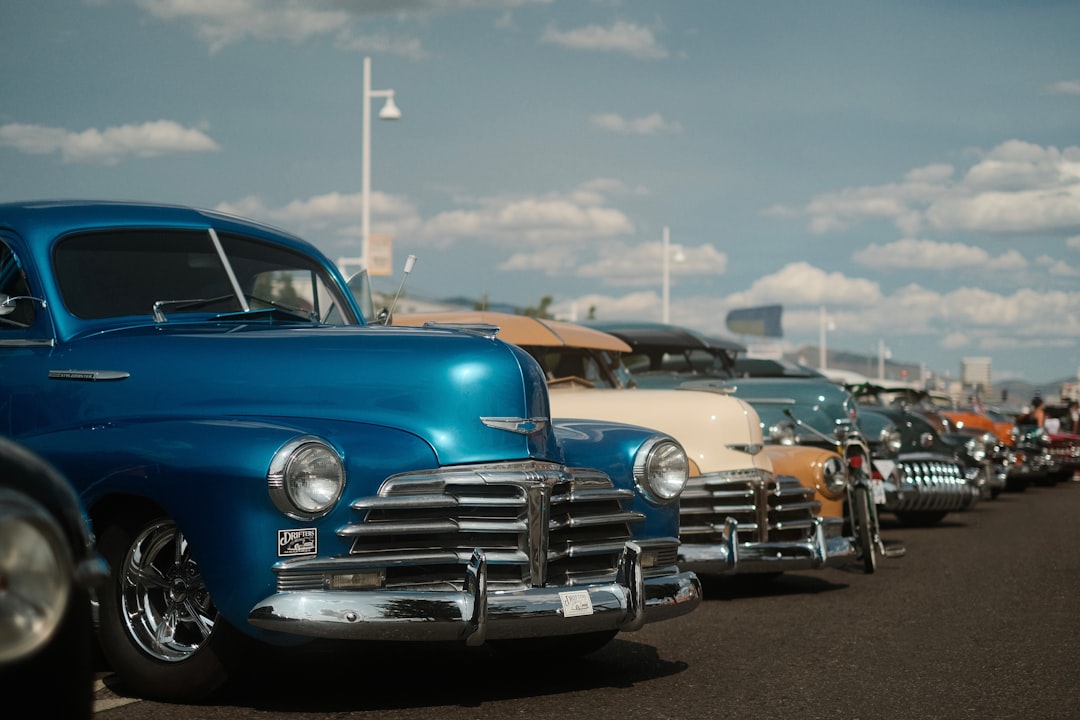 blue classic car on road during daytime