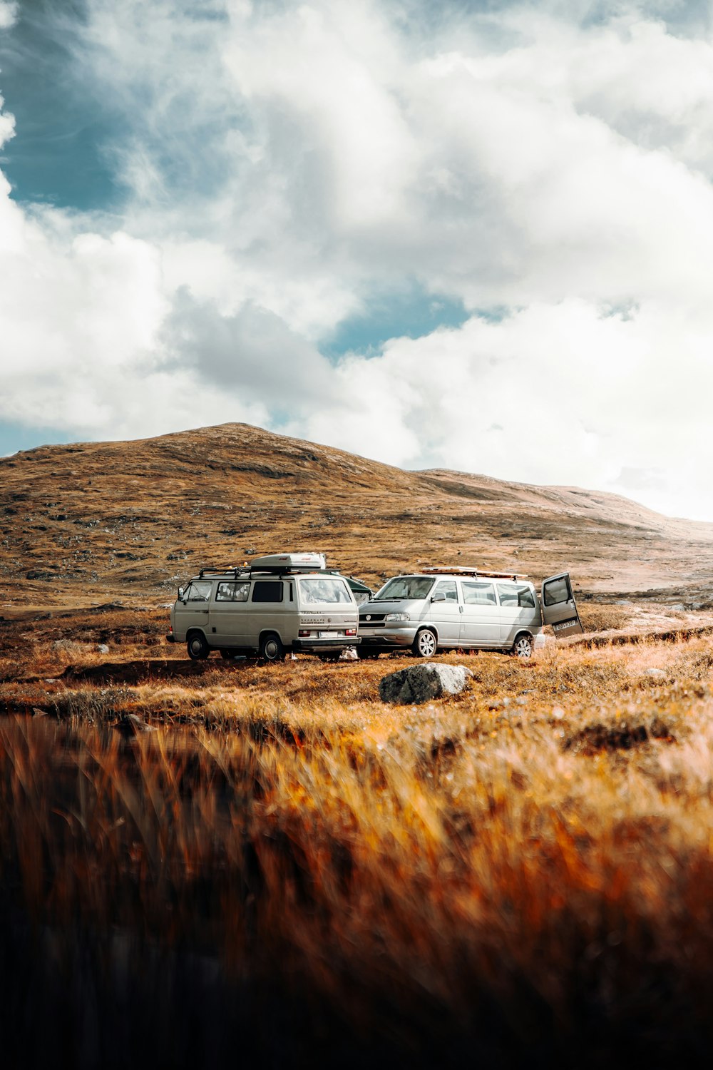 white suv on brown grass field during daytime