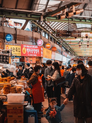 people in market during daytime