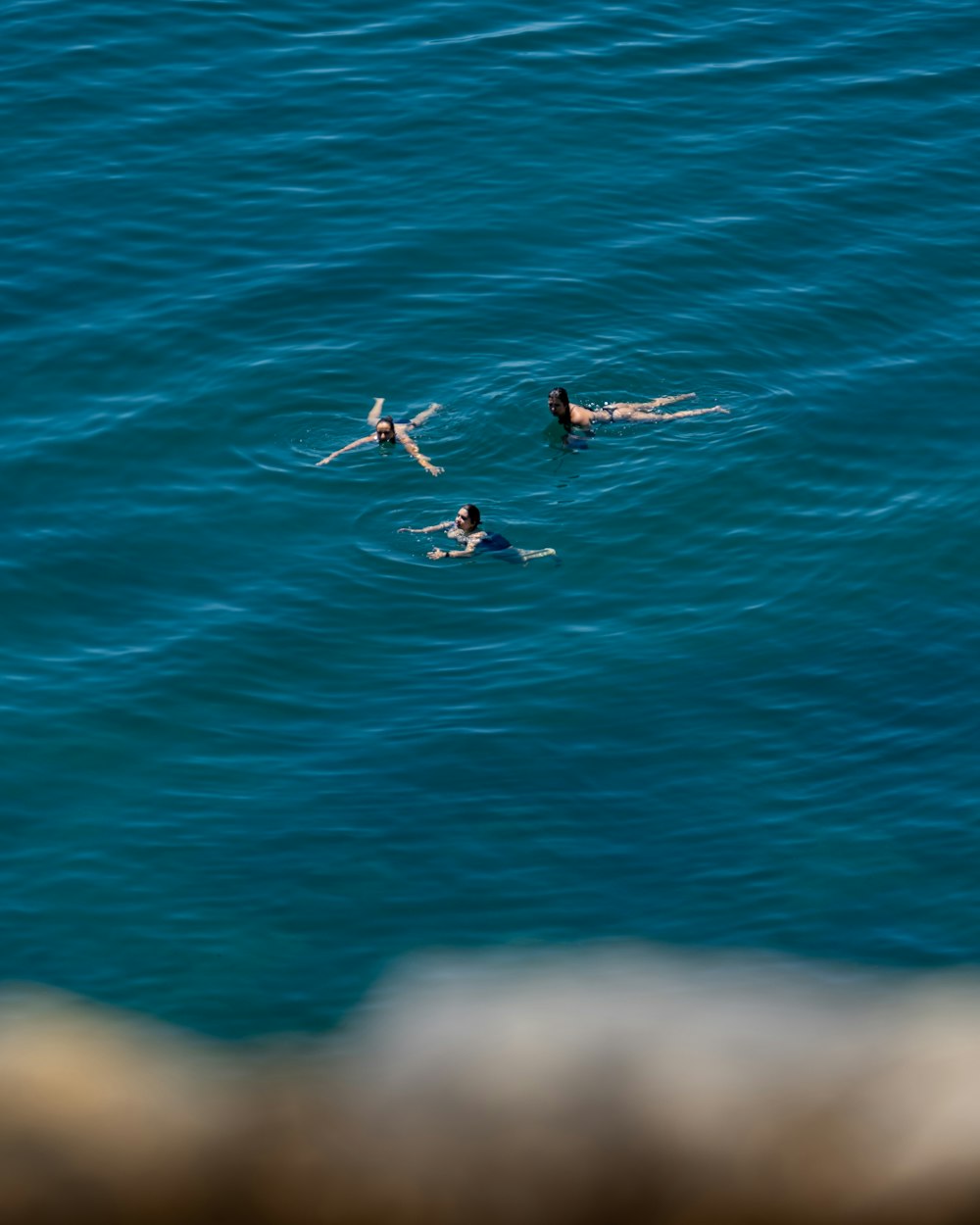 man surfing on blue sea during daytime