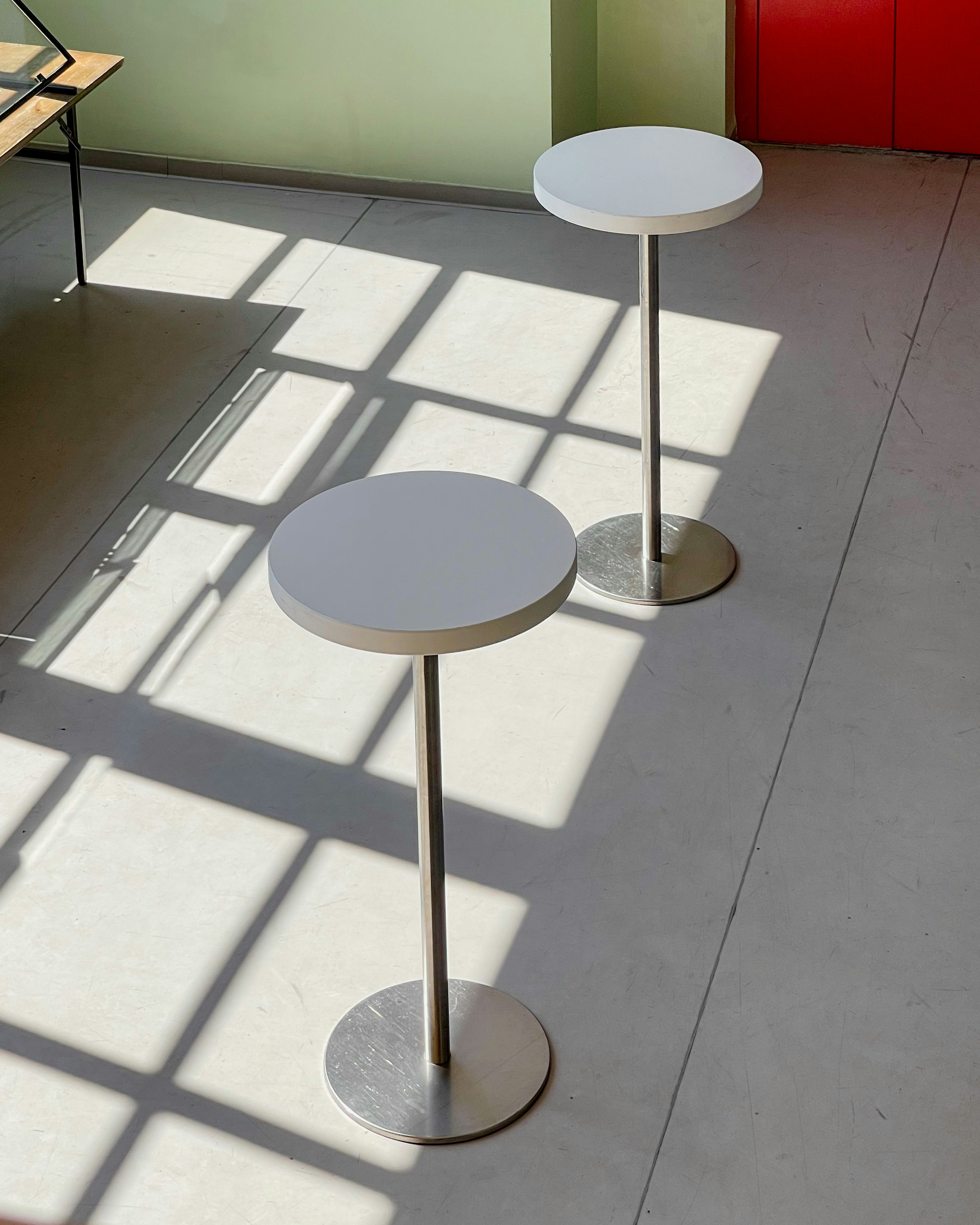 white round table on white floor tiles