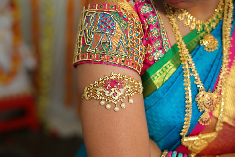 woman in red and gold sari