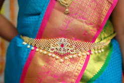 pink and gold textile on blue denim textile