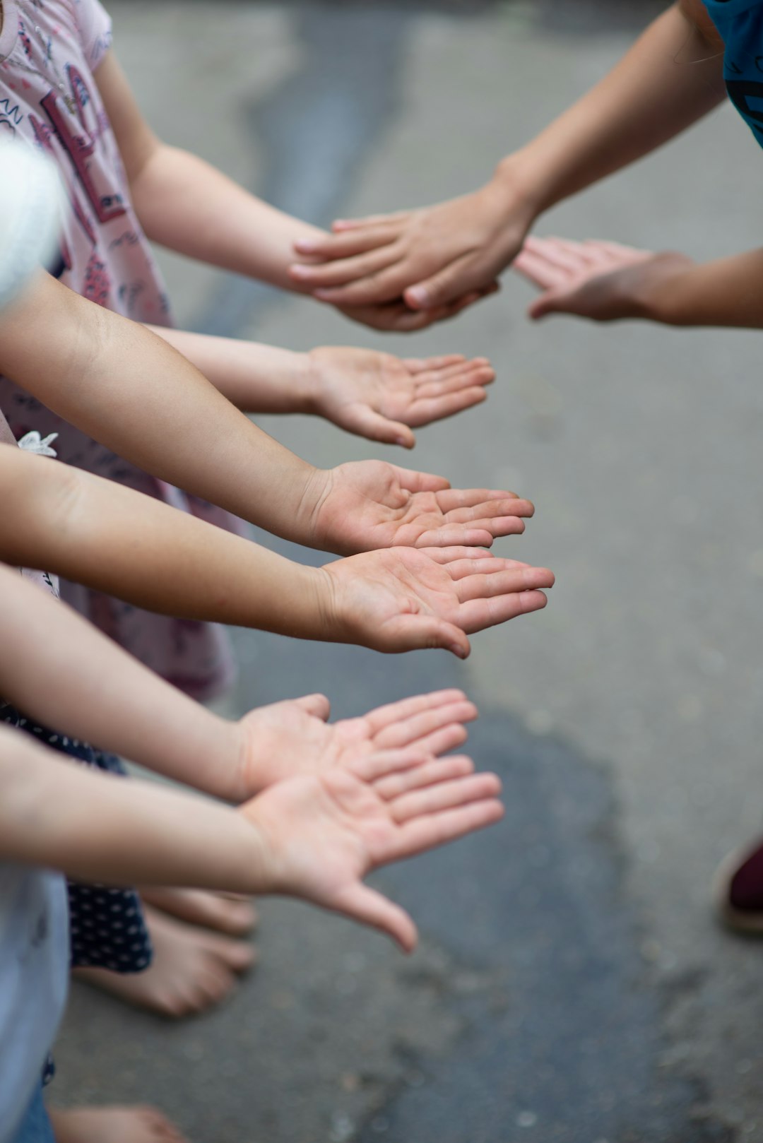 persons hands with white nail polish