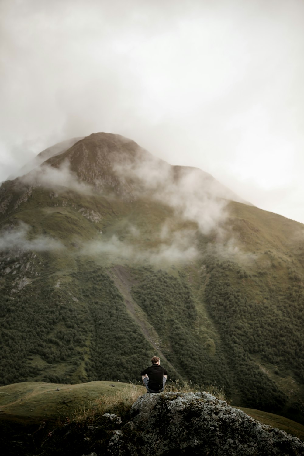 green mountain under white clouds during daytime