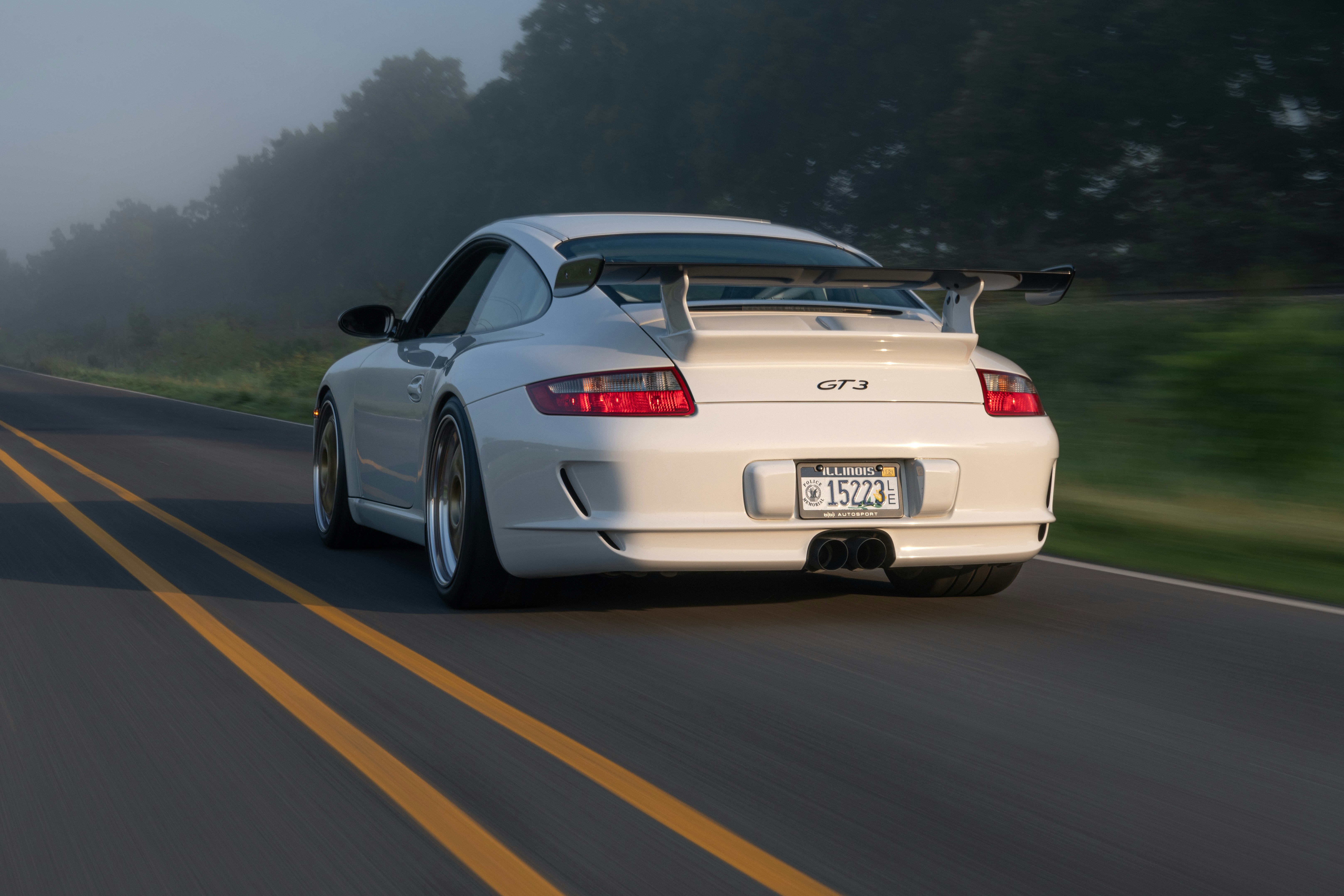 white bmw m 3 on road