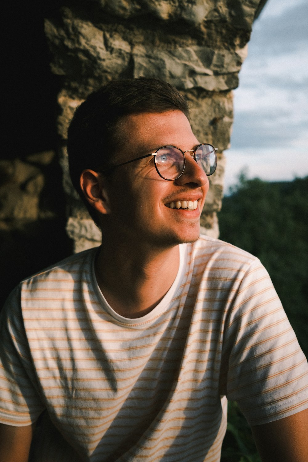 man in white crew neck shirt wearing black framed eyeglasses