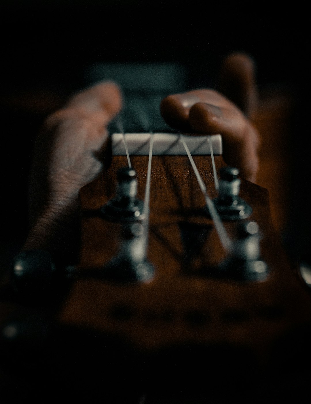 person playing guitar during daytime