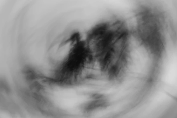 A simple yet striking black and white abstract swirl drawing emphasizing calm and focus
