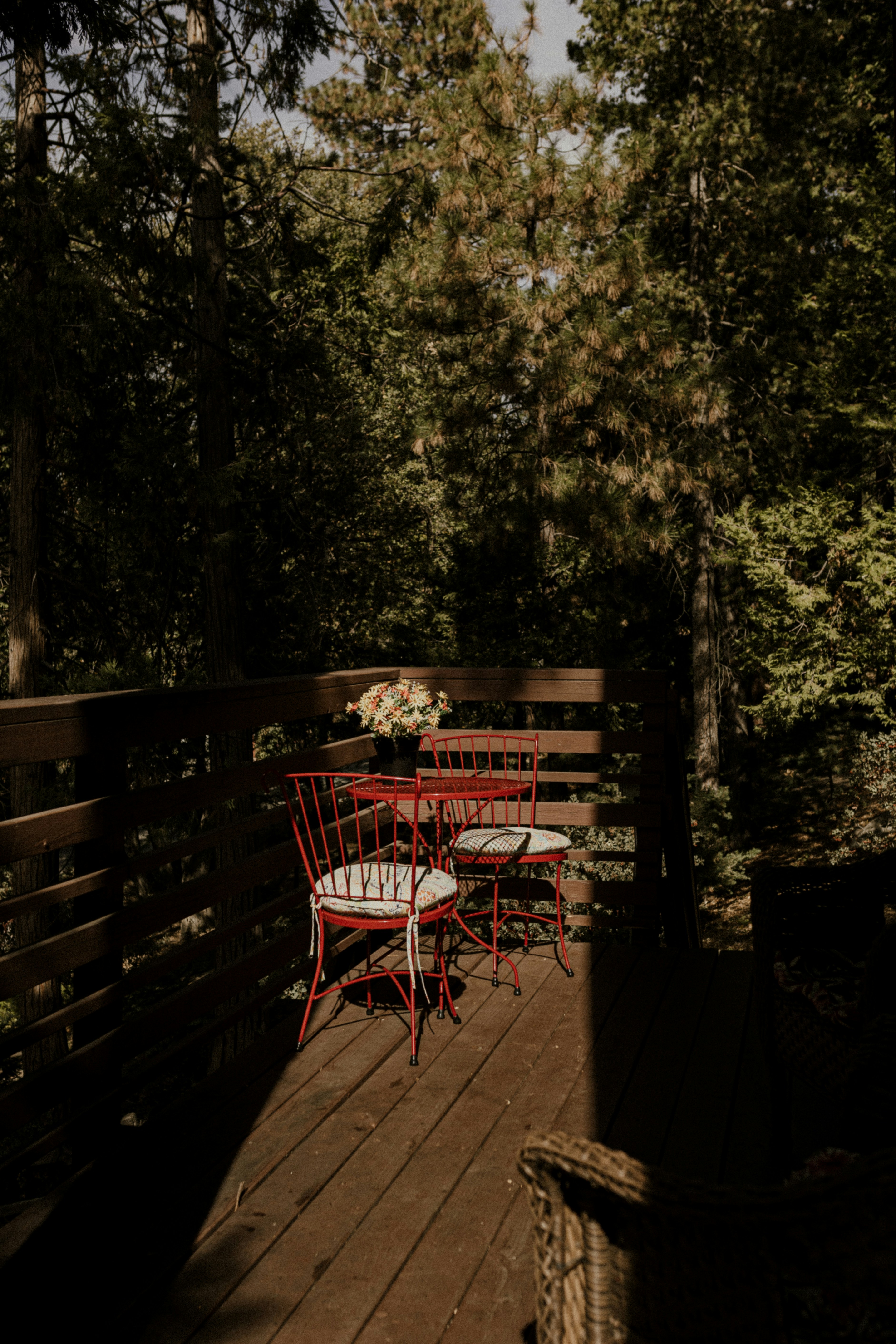 red metal chairs on brown wooden floor