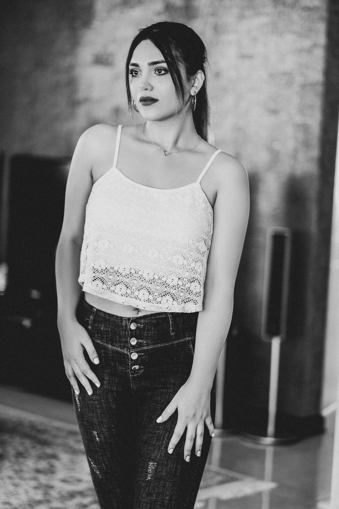 woman in white tank top and black denim shorts