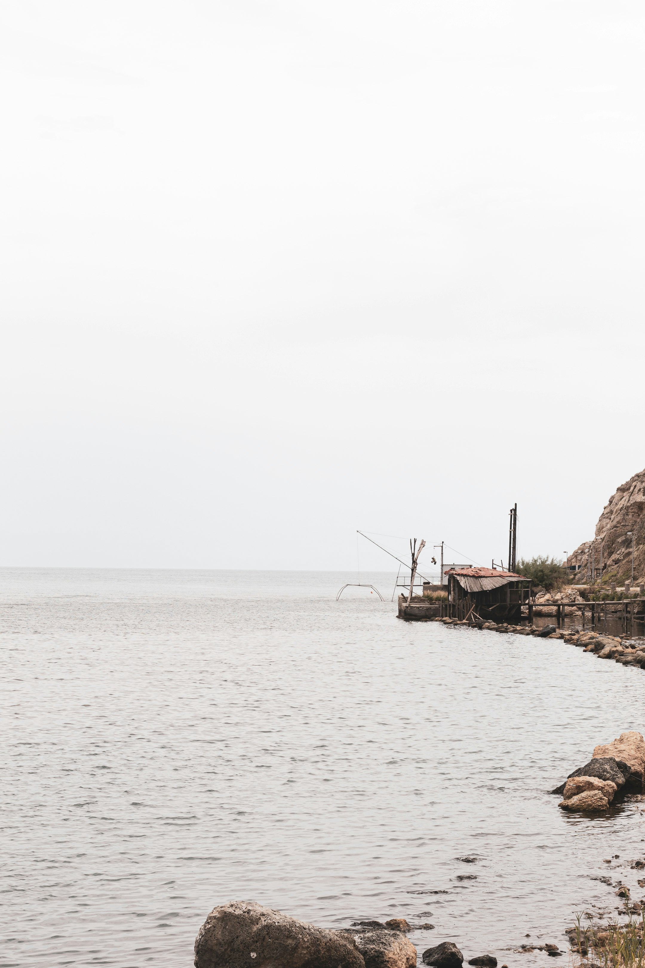 brown wooden dock on body of water during daytime