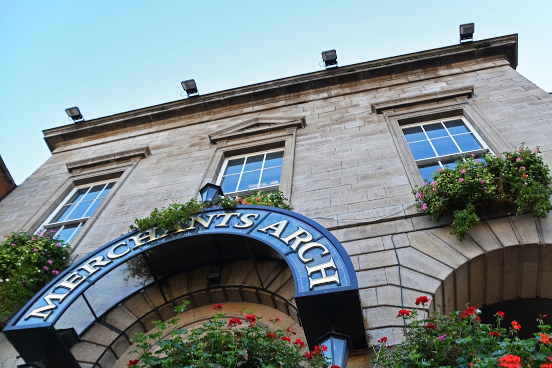 brown brick building with blue and white signage