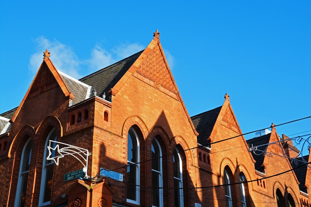 brown brick building under blue sky during daytime