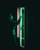 User interacting with a vape vending machine in a discreet retail environment.