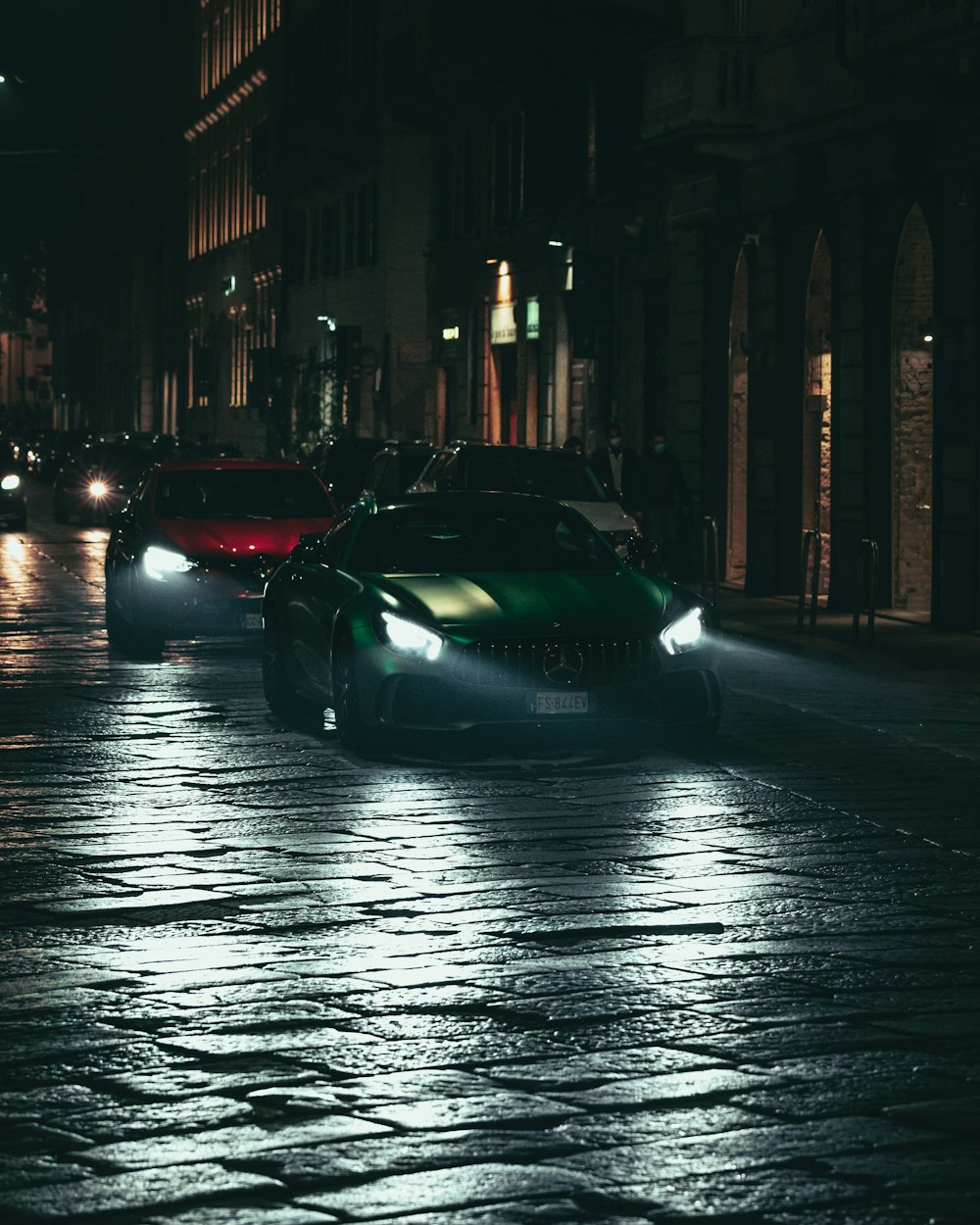 black porsche 911 parked on street during night time