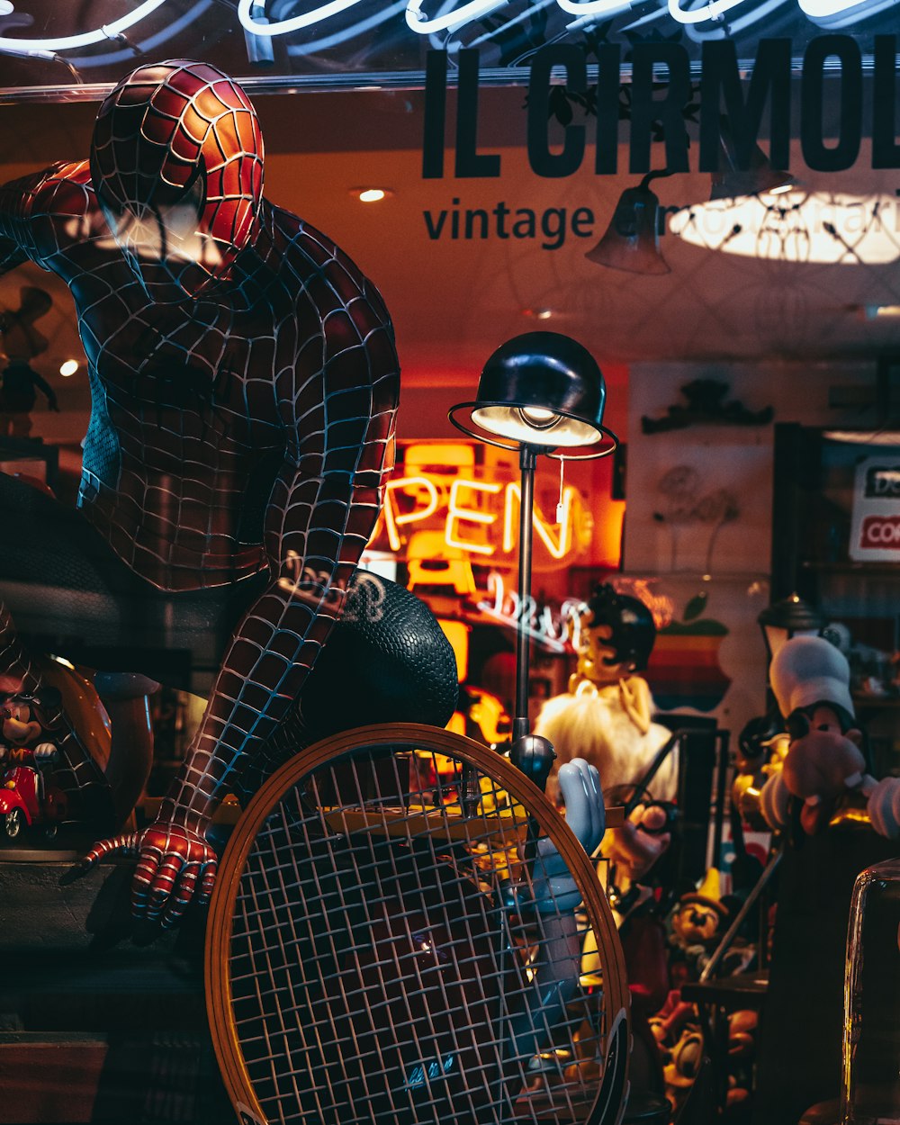 man in black and white checkered long sleeve shirt and blue denim jeans sitting on red