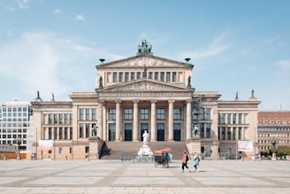people walking near brown concrete building during daytime
