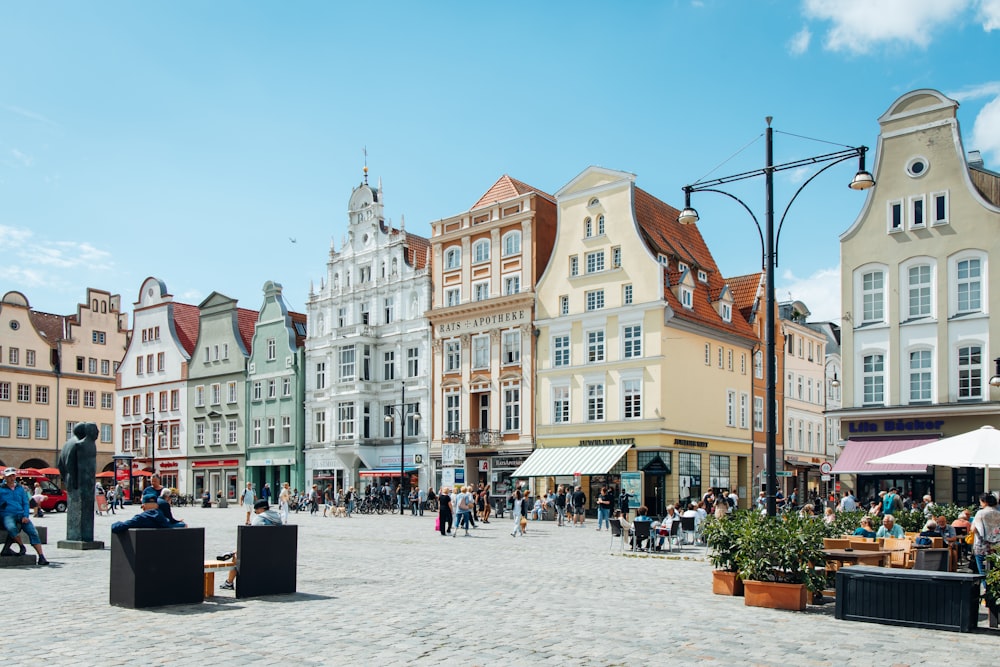 people walking on street near buildings during daytime