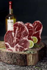 raw meat on brown wooden chopping board