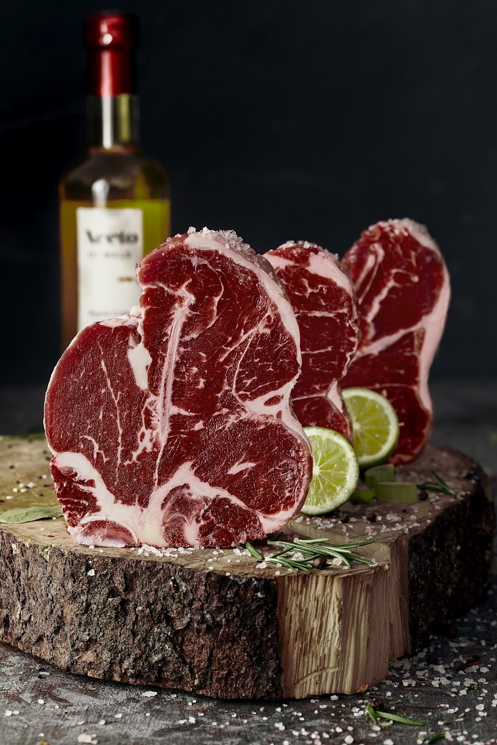 raw meat on brown wooden chopping board