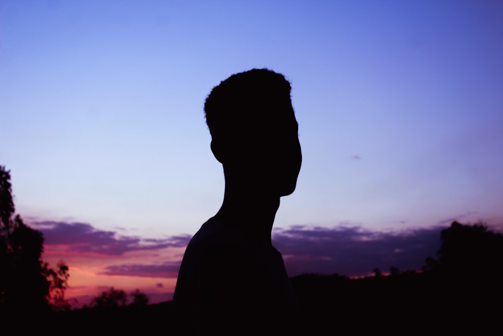 silhouette of man during sunset