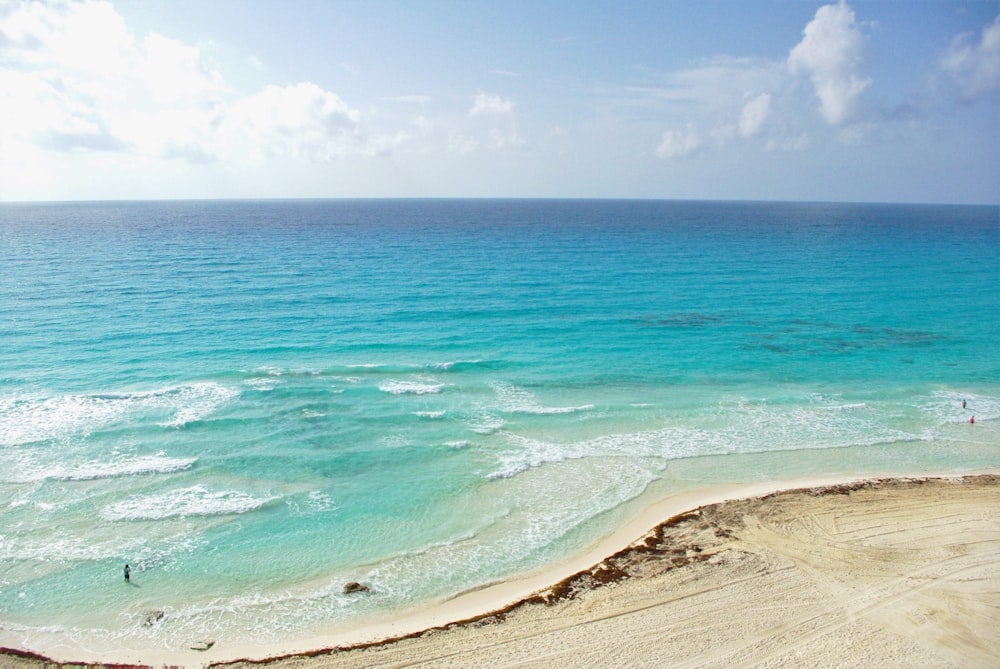 blue sea under blue sky during daytime